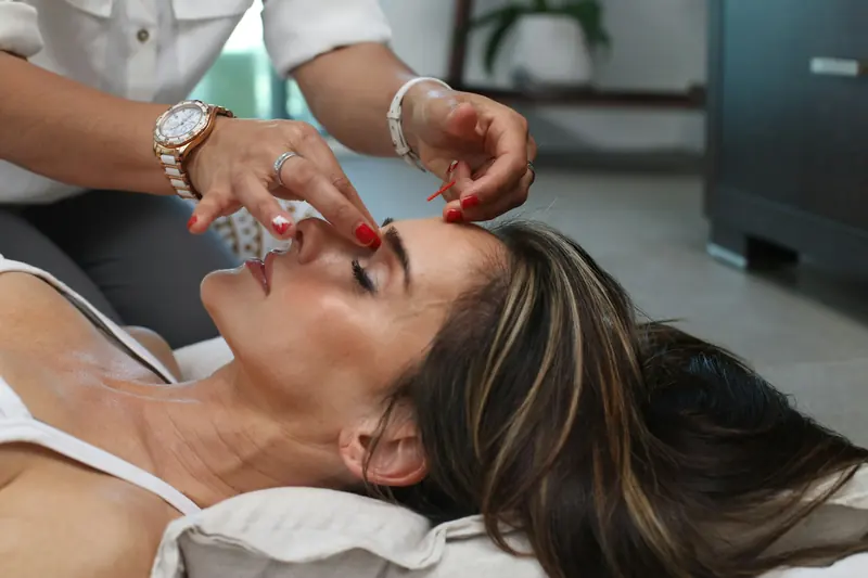 Guest relaxing during a restorative facial treatment