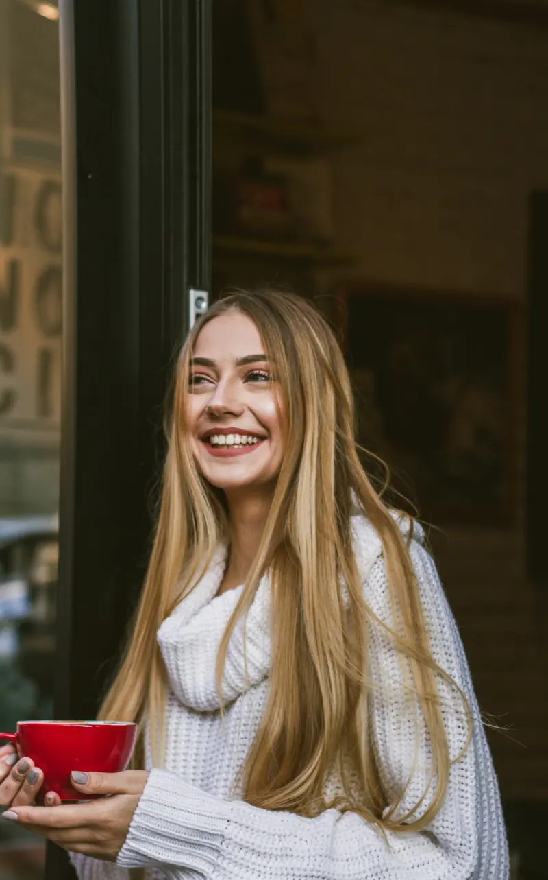 Smiling woman with luminous, natural-looking skin