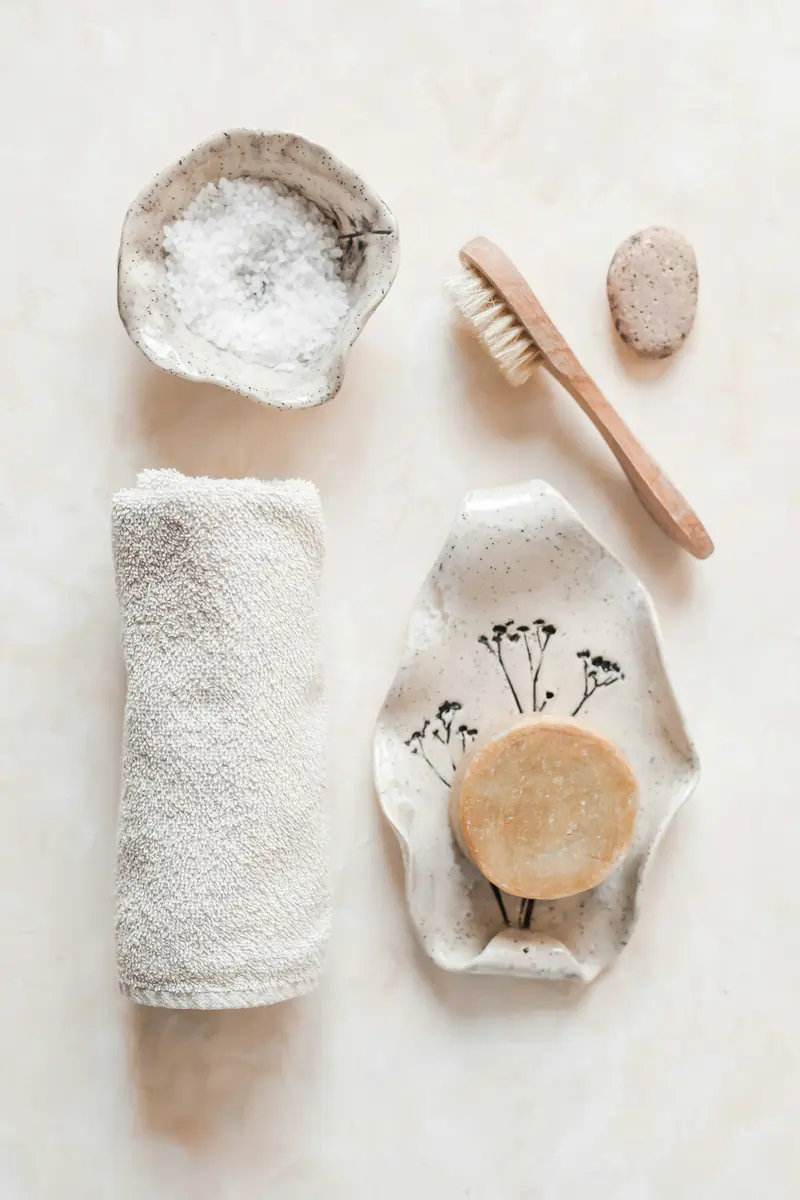 Soft towels and skincare arranged on a linen surface